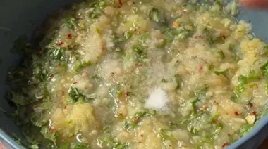 Liquid aloo paratha being cooked on tawa with golden crisp edges 2